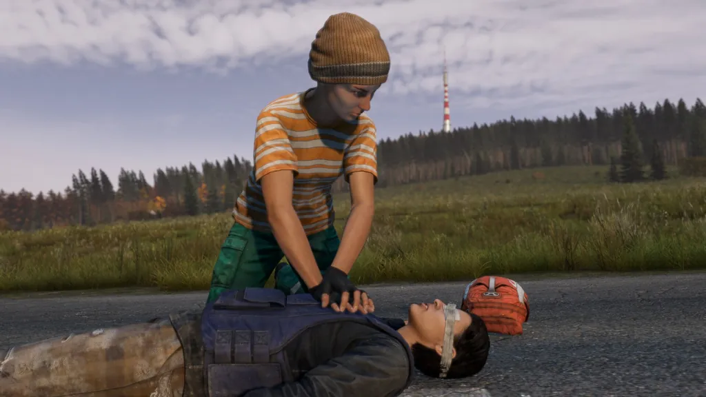 Survivor performing chest compressions on a wounded survivor beside a medical pack on a rural road