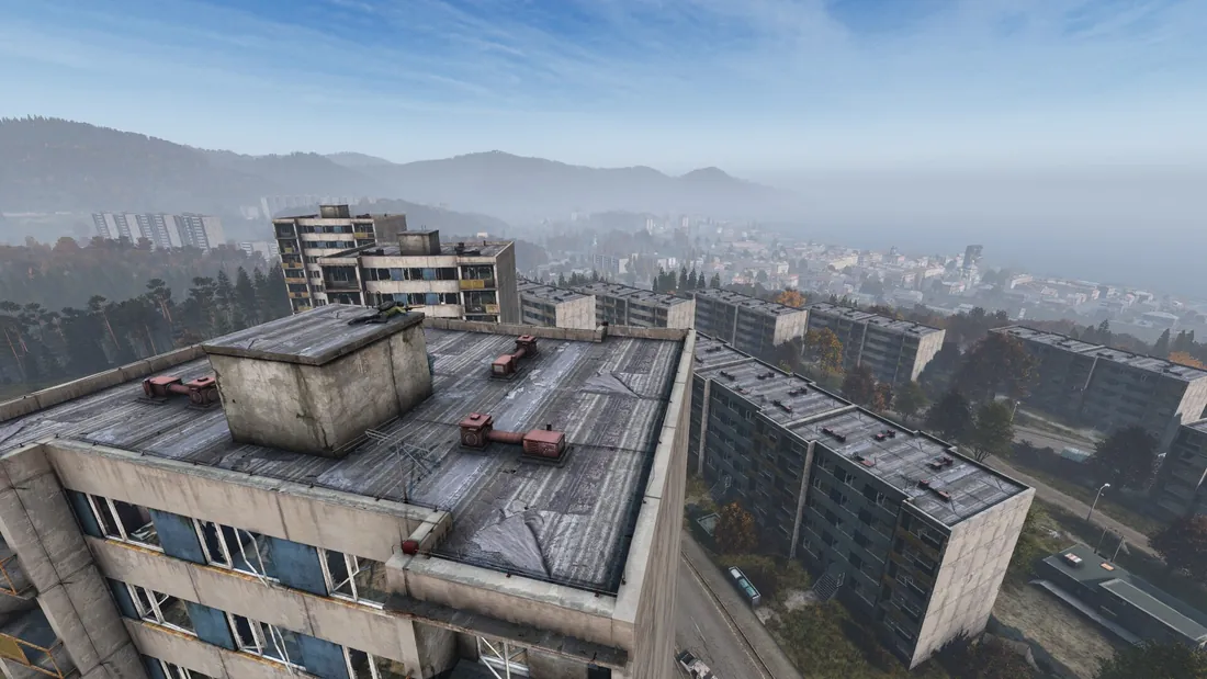 Rooftop view over dense concrete apartment blocks in a DayZ city